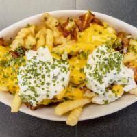 Loaded Fries · Cheese, bacon, sour cream, and chives.