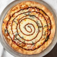 Margherita Pizza · Garlic butter sauce, tomato, garlic, Mozzarella, fresh basil, sea salt and balsamic drizzle.
