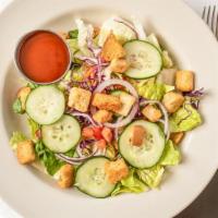 Tossed Salad · Romaine, carrot, tomato, onion, croutons.