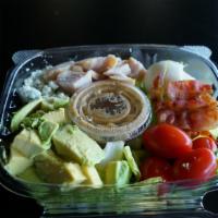 Classic Cobb Salad · Regular. Chopped romaine lettuce, bacon crumbles, diced chicken, avocado, blue cheese, tomat...