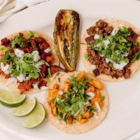 Tacos · Corn soft tortilla, any meat, cilantro, and onion.