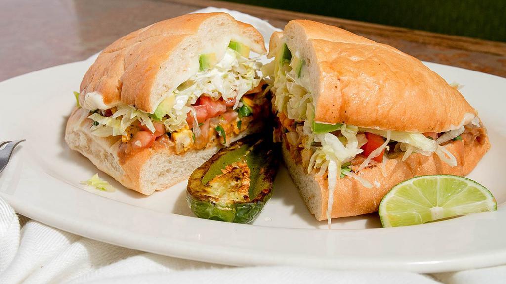 Tortas · Soft bread with beans, any meat, cilantro, onion, lettuce, sour cream, cheese and avocado.