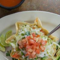 Taco Salad · Served in a flavor tortilla shell, meat, cheese, cilantro, onion, lettuce, tomato, and sour ...
