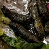 Lamb Grape Leaves · 8 pieces grape leaves stuffed with ground meat and rice.