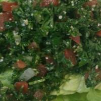 Tabbouleh Salad · A chopped parsley salad with tomatoes, scallions, cracked wheat, olive oil, lemon juice and ...