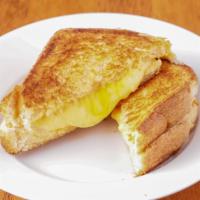 Grilled Cheese · Our grilled cheese has three cheese on thick cut texas toast! First, we put two slices of am...