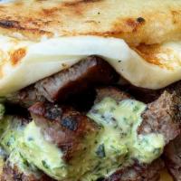 614 Arepa · Grilled beef, grilled cheese, and cilantro sauce