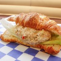 Home-Made Tuna Salad · Classic tuna salad with  our own twist  on a bed lettuce and fresh croissant.