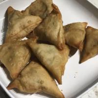 Vegetable Samosas · Vegetarian. Spicy. Will serve one person. Pastry turnovers stuffed with potatoes, peas, cumi...