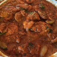 Chicken Karahi · Spicy. Per person. Chicken cooked in an Indian wok with tomatoes and green chilies. Served w...