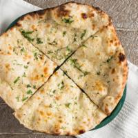 Garlic Naan · Vegetarian. We will serve two people. Leavened flatbread with garlic.