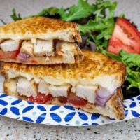 Buffalo Chicken Panini · Red hot sauce, spicy ranch sauce, onion, chicken and cheese.