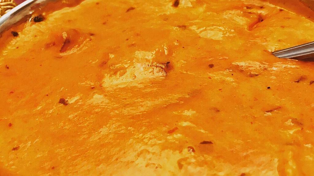Butter Chicken · Chicken cooked with creamy tomato sauce and spices.