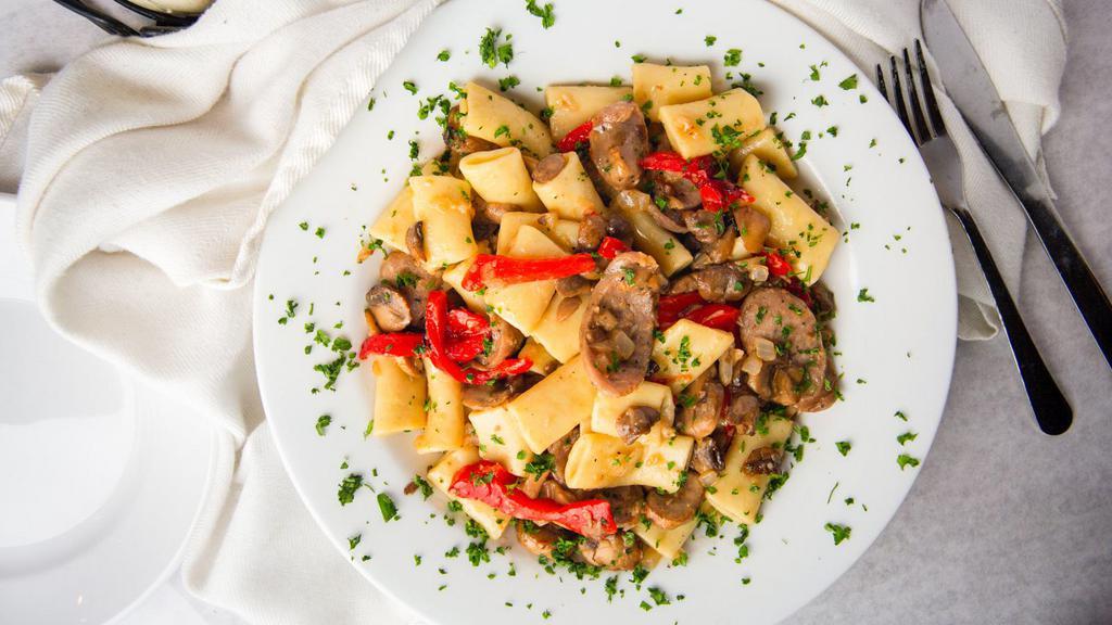 Sausage & Peppers Pasta · Carfagna’s famous Italian Festival sausage, sliced and sautéed in olive oil with sweet roasted red peppers, onions, fresh mushrooms, garlic, and tossed with homemade rigatelli pasta.