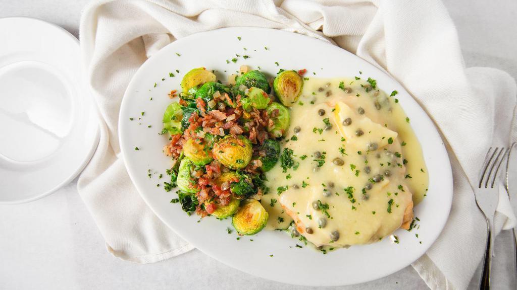 Chicken Or Veal Picatta · A whole boneless chicken breast sauteed with lemon butter and capers in a white wine sauce.