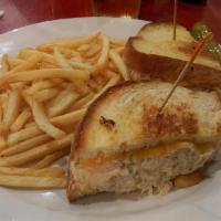 Tuna Melt · Griddled sandwich with tuna salad, melted yellow cheddar, tomato, and your choice of bread.