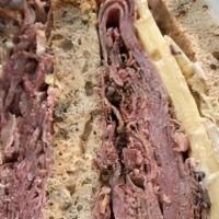 Reuben Melt · Griddled sandwich with pastrami, melty Swiss cheese, sauerkraut, Thousand Island dressing, s...