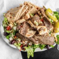 Omega Salad · Greek salad, chicken & gyro meat topped with omega dressing and Greek vinaigrette..
