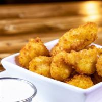 Cheese Curds · The real deal, lightly battered and fried to perfection. Served with chipotle raspberry.
