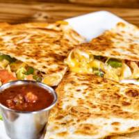 Epic Quesadilla · Loaded with seasoned chicken, onion, peppers and cheese. With avocado cream and salsa.