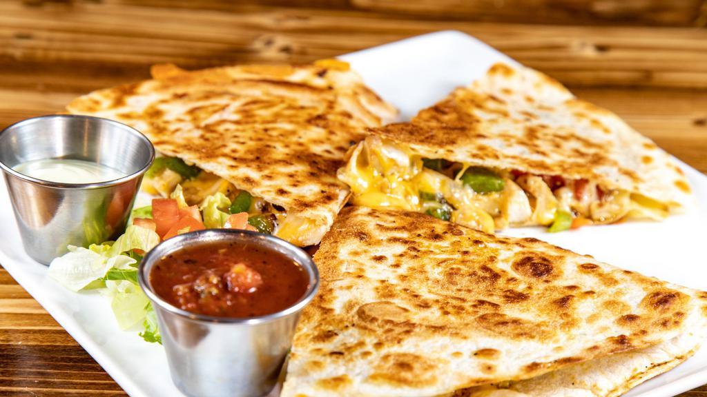 Epic Quesadilla · Loaded with seasoned chicken, onion, peppers and cheese. With avocado cream and salsa.