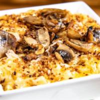Truffle And Mushroom Mac · Truffle oil and our homemade cheese sauce mixed with mushrooms and topped with toasted panko...