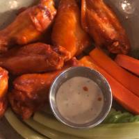 Buffalo Jumbo Wings · Baked then fried to order and tossed in our buffalo sauce (6 pieces)
