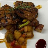 Pork Chop · Marinated 12 oz center  cut pork chops in citrus soy and fresh herbs grilled to perfection, ...