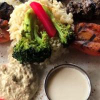 Middle Eastern Dinner For Four · Kofta (Minced beef meat loaf) dinner with charred tomatoes and broccoli, Served with rice an...