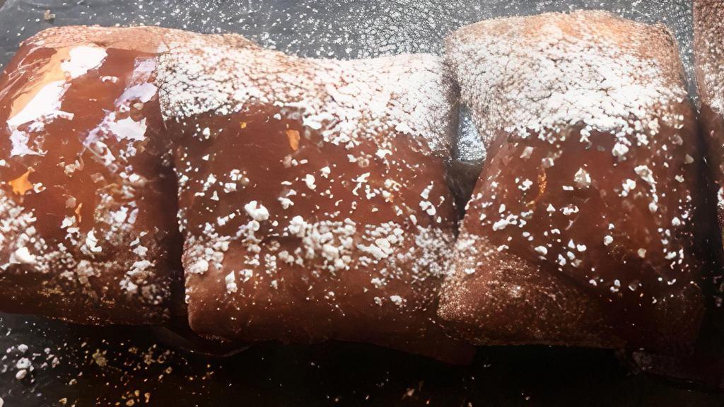 Beignets · Served with a caramel sauce and dusted with cinnamon sugar.