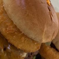 Bbq Rodeo Sliders · 2 three oz cheeseburger with cheddar a fried onion ring topped w/ Bbq sauce pickle chips