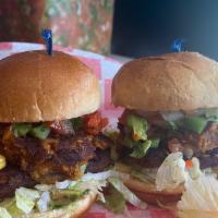 Black Bean Sliders · Vegetarian patty with chipotle black bean and corn topped w/ lettuce, tomatoes, onion, & Swi...