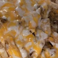 Beef & Cheese Fries · Hand-cut Fries topped w/seasoned ground beef & shredded cheese & grilled onion