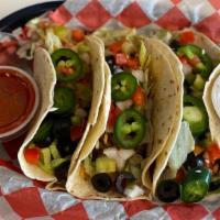 Chicken Tacos  · 3 Chicken tacos topped w/ shredded cheese, lettuce, tomatoes, onion, black olives, jalapeños...
