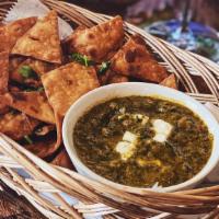 Palak Dip · Fresh spinach blended with Indian spices and mozzarella cheese. Served with roti chips.