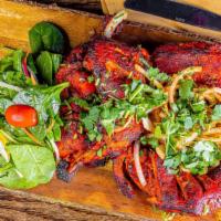 Tandoori Chicken · Whole roasted chicken marinated overnight in traditional spices, herbs and yogurt.
Served wi...