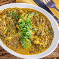 Palak Paneer · Cubes of homemade cottage cheese cooked in onion tomato sauce with fresh spinach.