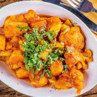 Aloo Gobi · Is a popular Indian dish in which fresh potatoes and cauliflower are sautéed with onions, to...