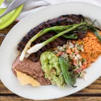 Carne Asada · Char-broiled skirt steak served with pico de gallo and guacamole.