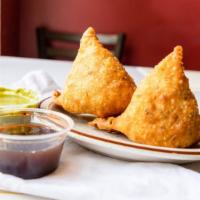 Samosa (2) · Crispy crust filled with potato and peas.
The popular appetizers. Served with Mint and Tamar...