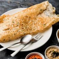 Onion Rava Masala Dosa · Rice and wheat crepe with spiced onion and potato. Served with a variety of chutneys and sam...