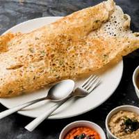 Rava Masala Dosa · Thin rice crepe made with cream of wheat and filled with spiced onions and potato. Served wi...