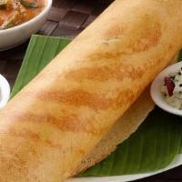 Paper Masala Dosa · Very thin rice crepe filled with spiced onions and potato. Served with a variety of chutneys...