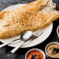 Rava Dosa · Thin rice crepe made with cream of wheat and rice flour. Served with a variety of chutneys a...
