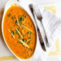 Mutter Panneer · Panneer and fresh green peas cooked with tomato creamy sauce, spices and herbs. Served with ...