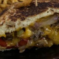 Philly Grilled Cheese · Texas toast, colby jack, philly cheese steak, diced red and green peppers and caramelized on...
