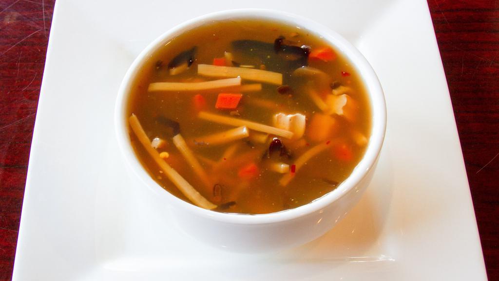 Hot & Sour Soup (Small) · Tofu, bamboo, black mushroom, and carrot simmered in our hot and sour broth, topped with celery.