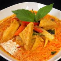 Red Curry · Eggplant, bamboo, bell peppers, and basil simmered in red curry and coconut milk.