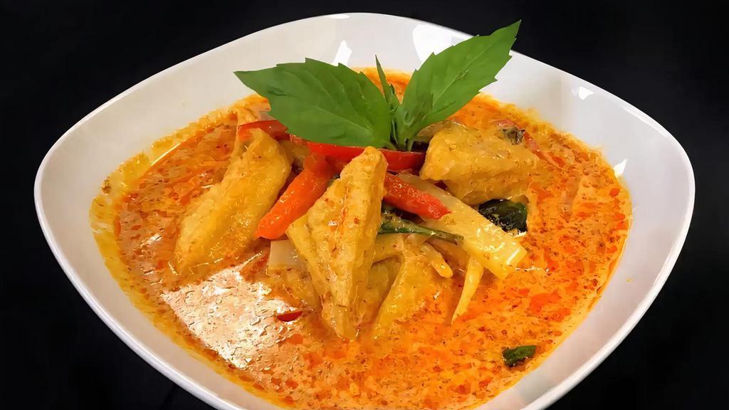 Red Curry · Eggplant, bamboo, bell peppers, and basil simmered in red curry and coconut milk.