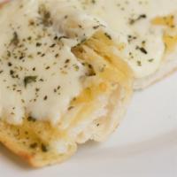Chee-Zee Garlic Bread · Italian bread topped with garlic butter, mozzarella, and Italian seasonings and baked until ...